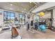 Well-lit community gym with modern equipment, large windows, and a variety of exercise machines at 3412 Yellowtop Loop, Clermont, FL 34714