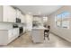 Bright, modern kitchen featuring an island with seating and stainless steel appliances at 3412 Yellowtop Loop, Clermont, FL 34714