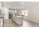 Modern kitchen featuring an island with seating and stainless steel appliances at 3412 Yellowtop Loop, Clermont, FL 34714