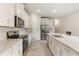 Modern kitchen featuring granite countertops and stainless steel appliances at 3412 Yellowtop Loop, Clermont, FL 34714
