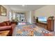 Bright living room featuring a cozy seating area and sliding glass doors that bring the outdoors in at 3412 Yellowtop Loop, Clermont, FL 34714