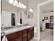 Bathroom features a double sink vanity and a view into the Bedroom at 3630 Supreme Ct, Apopka, FL 32703