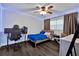 Well-appointed bedroom with blue LED lighting and a desk for work at 3924 Rose Of Sharon Dr, Orlando, FL 32808