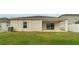 Spacious backyard with a covered patio and well-maintained lawn, offering a private outdoor space at 3969 Southern Vista Loop, St Cloud, FL 34772