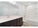 Modern bathroom featuring a vanity with dark brown cabinets and shower at 3969 Southern Vista Loop, St Cloud, FL 34772