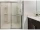 Modern bathroom featuring tiled shower and vanity with storage at 3969 Southern Vista Loop, St Cloud, FL 34772