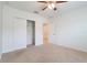 Bright bedroom with ceiling fan, carpet floors, and sliding door closet at 3969 Southern Vista Loop, St Cloud, FL 34772