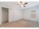 Neutral bedroom featuring carpet floors, a closet, a window, and ceiling fan at 3969 Southern Vista Loop, St Cloud, FL 34772