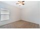 Neutral bedroom featuring carpet floors, a window, and a ceiling fan at 3969 Southern Vista Loop, St Cloud, FL 34772