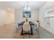 Stylish dining area with an elegant chandelier and a modern table set, great for entertaining at 3969 Southern Vista Loop, St Cloud, FL 34772