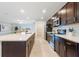 Spacious kitchen with a large island, stainless steel appliances, and sleek cabinetry at 3969 Southern Vista Loop, St Cloud, FL 34772