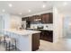 Modern kitchen with sleek countertops, stainless appliances, and ample cabinet space at 3969 Southern Vista Loop, St Cloud, FL 34772