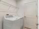 Laundry room featuring new washer and dryer and storage shelves at 3969 Southern Vista Loop, St Cloud, FL 34772