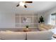 Bright living area showcasing modern paneling, stylish seating, and a view to the outdoors at 3969 Southern Vista Loop, St Cloud, FL 34772