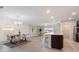 Bright, open-concept living area with tile floors, adjacent to the kitchen and dining spaces at 3969 Southern Vista Loop, St Cloud, FL 34772