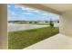 Covered patio overlooking lake and neighboring homes at 3969 Southern Vista Loop, St Cloud, FL 34772