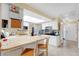 A bright and airy kitchen featuring butcher block countertops and white cabinetry at 4522 Flagg St, Orlando, FL 32812