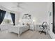 Bright bedroom with a white bed frame, stylish decor, and a well-lit workspace, creating a cozy and inviting atmosphere at 4849 Cypress Woods Dr # 1308, Orlando, FL 32811