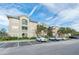 Multi-Gathering building with a parking lot and landscaping, featuring a neutral color palette at 4849 Cypress Woods Dr # 1308, Orlando, FL 32811