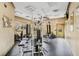 Well-equipped community gym with a variety of exercise machines and ample lighting for a convenient workout space at 4849 Cypress Woods Dr # 1308, Orlando, FL 32811