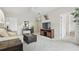 Comfortable living room featuring a television, sofa, and seamless access to other rooms, perfect for relaxation at 4849 Cypress Woods Dr # 1308, Orlando, FL 32811