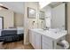 Bathroom with a large mirror over the vanity and an open view to the bedroom at 5025 Shoreway Loop # 20503, Orlando, FL 32819