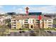 Beautiful multi-Gathering building featuring a tile roof, well-kept landscaping, and ample parking spaces at 5025 Shoreway Loop # 20503, Orlando, FL 32819