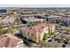 Aerial view showcasing Vista Cay condominiums in a vibrant urban setting with a pool and clubhouse at 5025 Shoreway Loop # 20503, Orlando, FL 32819