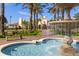 Elegant fountain at Vista Cay, offering a serene entrance with lush landscaping and a building in the background at 5025 Shoreway Loop # 20503, Orlando, FL 32819