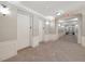 Well-maintained hallway with neutral colors, tile flooring, and access to elevators at 5025 Shoreway Loop # 20503, Orlando, FL 32819