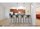 Kitchen with a breakfast bar, stainless steel appliances, and wood cabinets at 5025 Shoreway Loop # 20503, Orlando, FL 32819