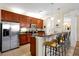 Kitchen featuring granite countertops, stainless steel appliances, and a breakfast bar with seating at 5025 Shoreway Loop # 20503, Orlando, FL 32819