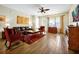 Inviting living room with wood-look tile flooring, a ceiling fan, and a large window at 5025 Shoreway Loop # 20503, Orlando, FL 32819