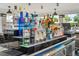 Poolside bar with a variety of liquors, perfect for enjoying refreshing drinks in a resort-style community at 5025 Shoreway Loop # 20503, Orlando, FL 32819