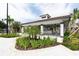 Charming poolside bar area, featuring a shaded structure, stylish seating, and lush landscaping at 5025 Shoreway Loop # 20503, Orlando, FL 32819