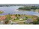 Overhead view of stunning lakeside residences with vibrant green lawns and mature trees at 534 Two Lakes Ln, Eustis, FL 32726