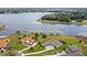 Lakeside homes boast meticulous landscaping and private drives in this aerial view at 534 Two Lakes Ln, Eustis, FL 32726