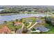 Expansive aerial view of lakeside homes featuring lush landscaping and private driveways at 534 Two Lakes Ln, Eustis, FL 32726