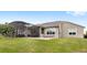 Large backyard featuring patio with seating near house at 534 Two Lakes Ln, Eustis, FL 32726