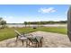 A patio in the backyard overlooking a tranquil lake at 534 Two Lakes Ln, Eustis, FL 32726