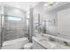Bathroom with vanity, granite countertop, large mirror and shower with glass door at 534 Two Lakes Ln, Eustis, FL 32726