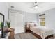 Bedroom featuring a window with views, neutral colors, carpet, and closet at 534 Two Lakes Ln, Eustis, FL 32726