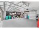 Two car garage with epoxy flooring and abundant storage for bikes, bins, and other equipment at 534 Two Lakes Ln, Eustis, FL 32726