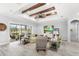 Relaxing living room featuring a ceiling fan, tray ceiling, and sliding glass doors to the outside at 534 Two Lakes Ln, Eustis, FL 32726