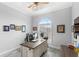 Home office with large arched window and plantation shutters, offers a quiet workspace at 534 Two Lakes Ln, Eustis, FL 32726