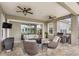 Outdoor living space with ceiling fans and comfortable seating near lake at 534 Two Lakes Ln, Eustis, FL 32726