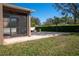The backyard has a screened-in porch with a brick patio, a brick fire pit, and a basketball hoop at 535 Belle Fern Ct, Ocoee, FL 34761