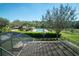 The backyard has a pool with a pool house and a basketball hoop at 535 Belle Fern Ct, Ocoee, FL 34761