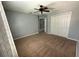 Bedroom offering carpet floors, a ceiling fan and a built-in closet at 535 Belle Fern Ct, Ocoee, FL 34761