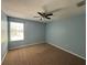 Bedroom featuring a ceiling fan, carpet floors and a sun-filled window at 535 Belle Fern Ct, Ocoee, FL 34761